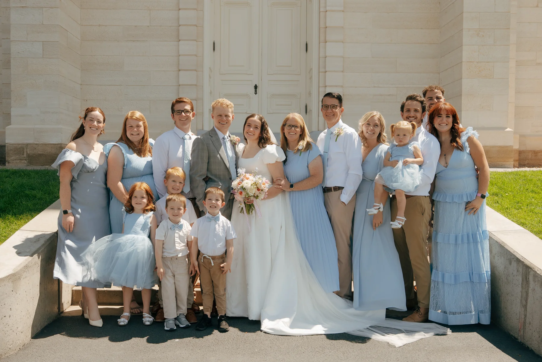 The Holman family gathered outdoors for a wedding